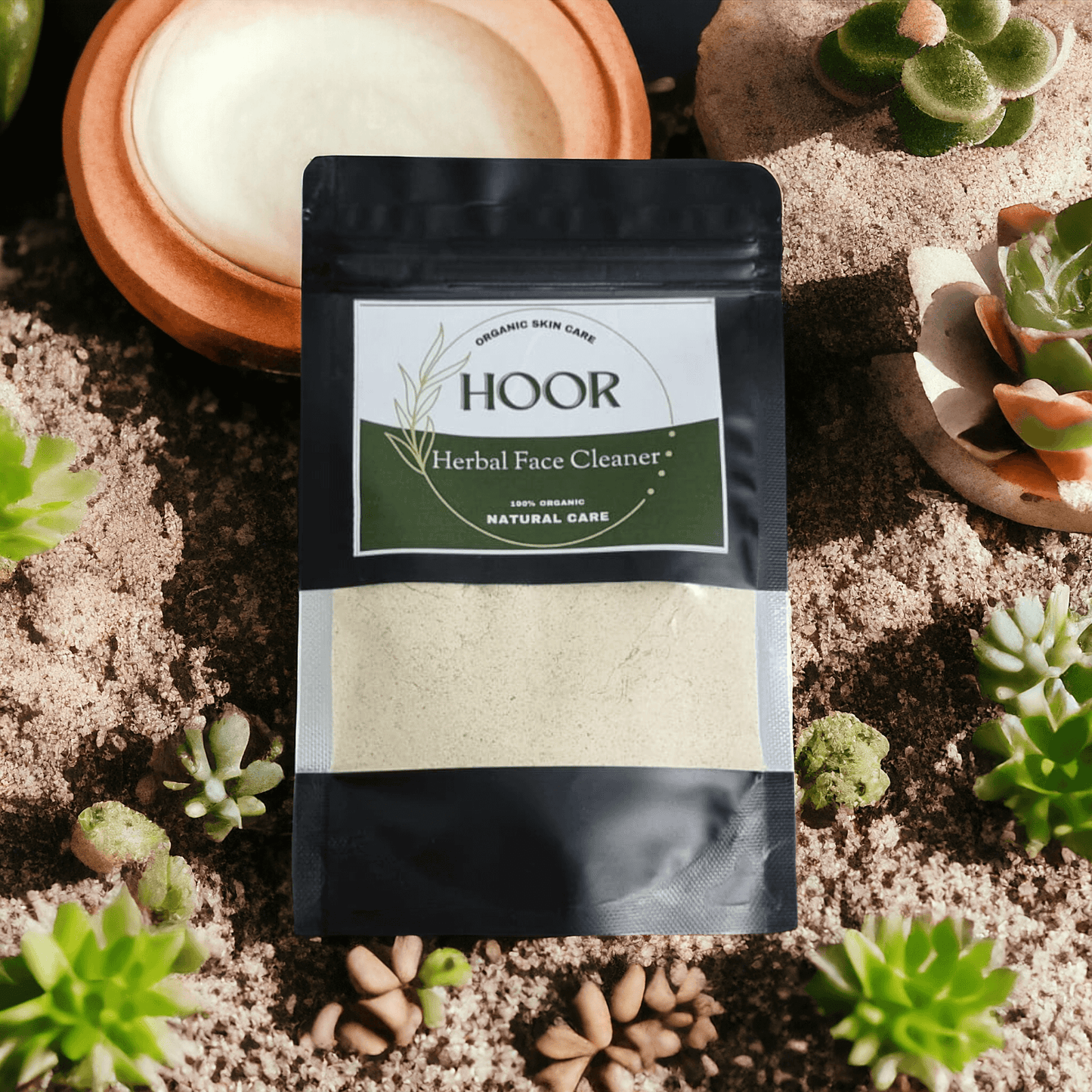 Herbal Face Cleaner pack on a natural backdrop with succulents; 100% organic, eco-friendly skincare.